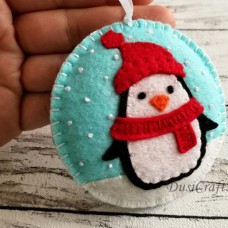 Božični okraski - pingvin na modrem ozadju